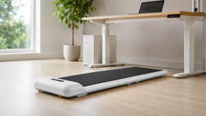 WalkingPad C2 compact under-desk walking pad unfolded on wood flooring in a modern home office