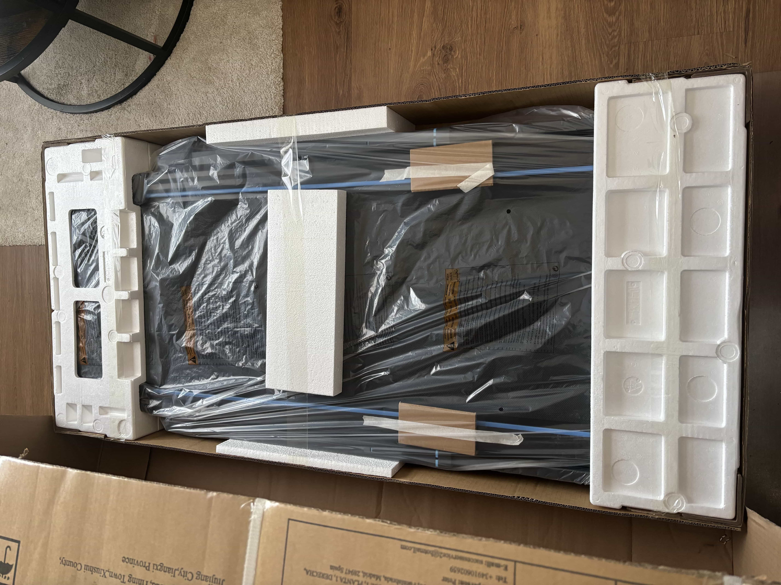 Wellfit TM032 opened, treadmill still in packaging