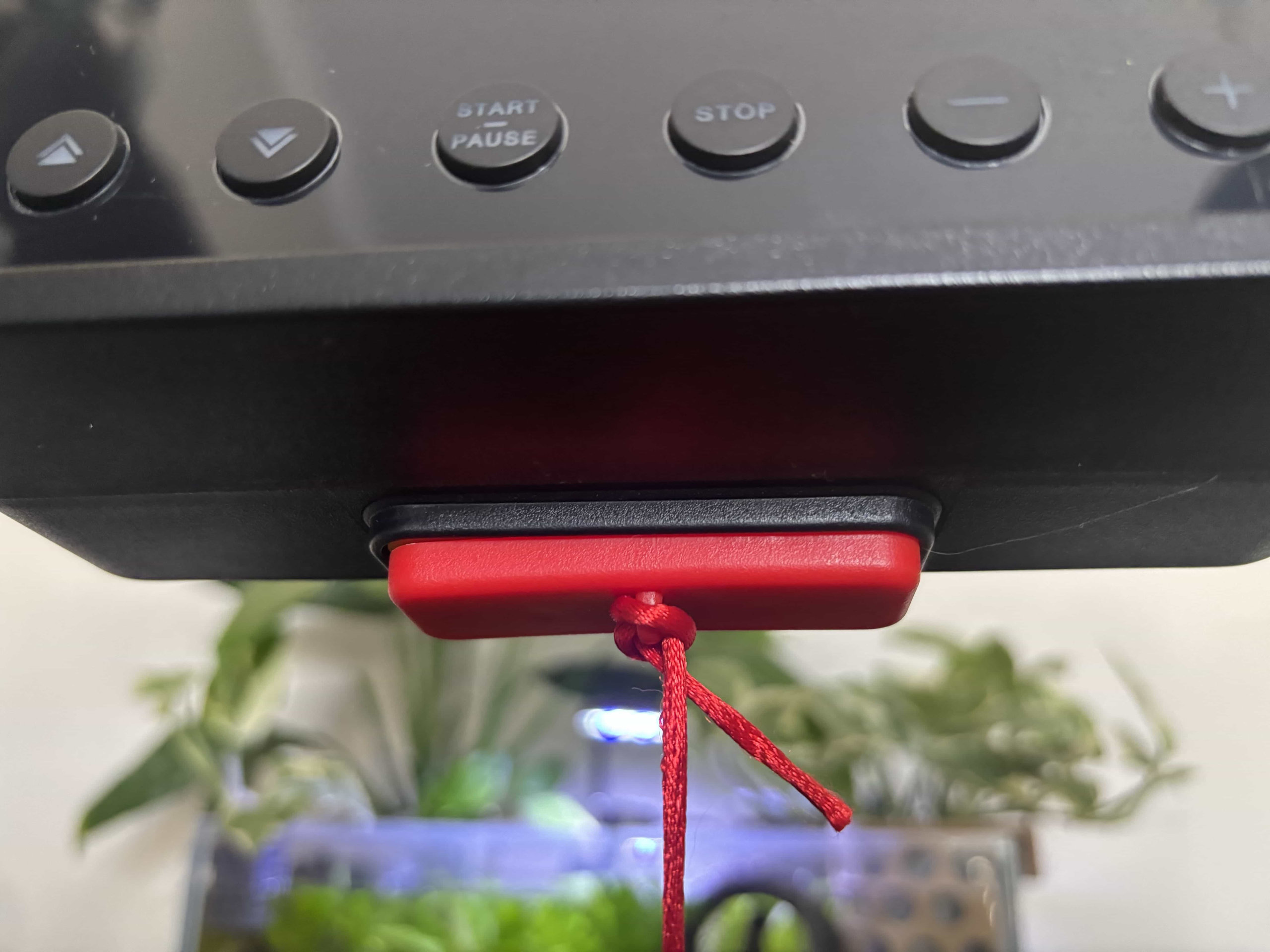 Magnetic emergency stop fitting into place