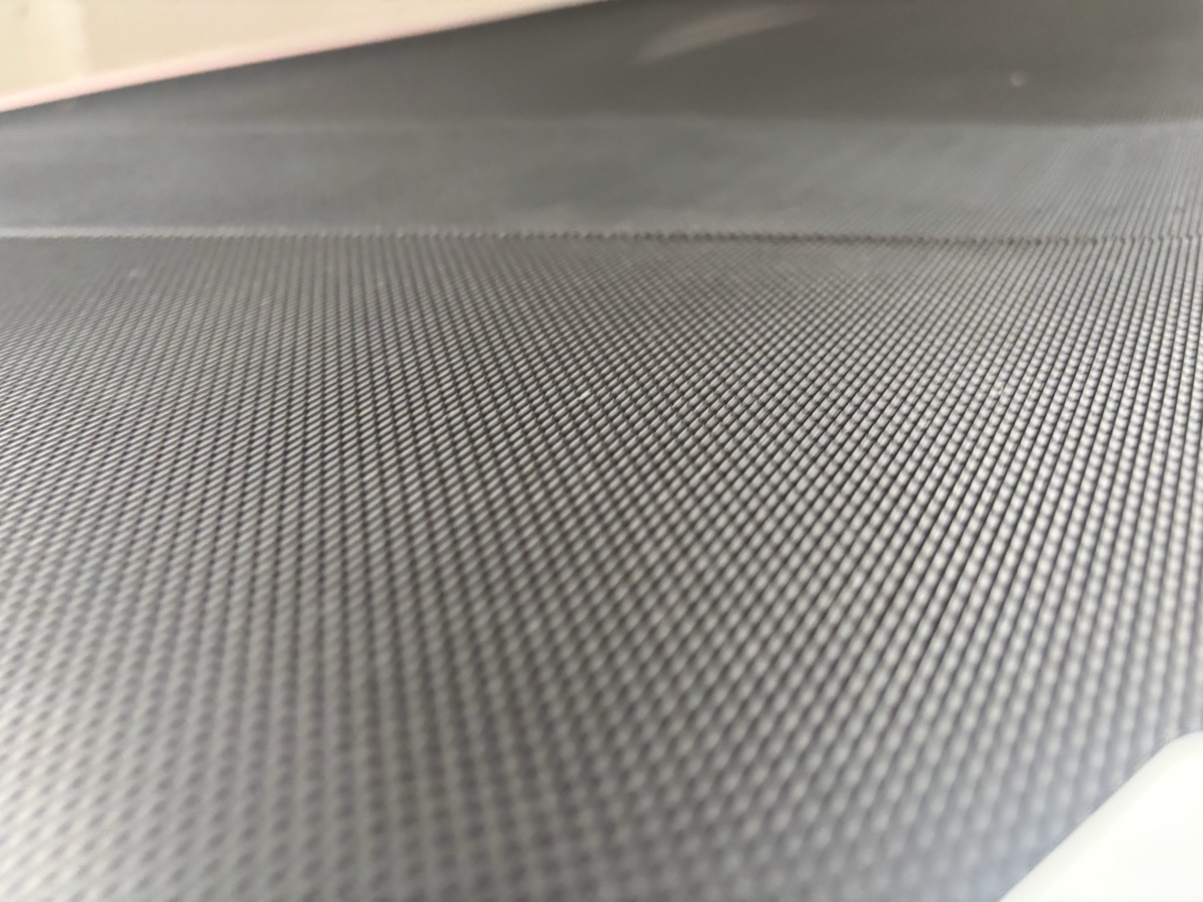 Close-up of the TM037 belt showing its lattice construction