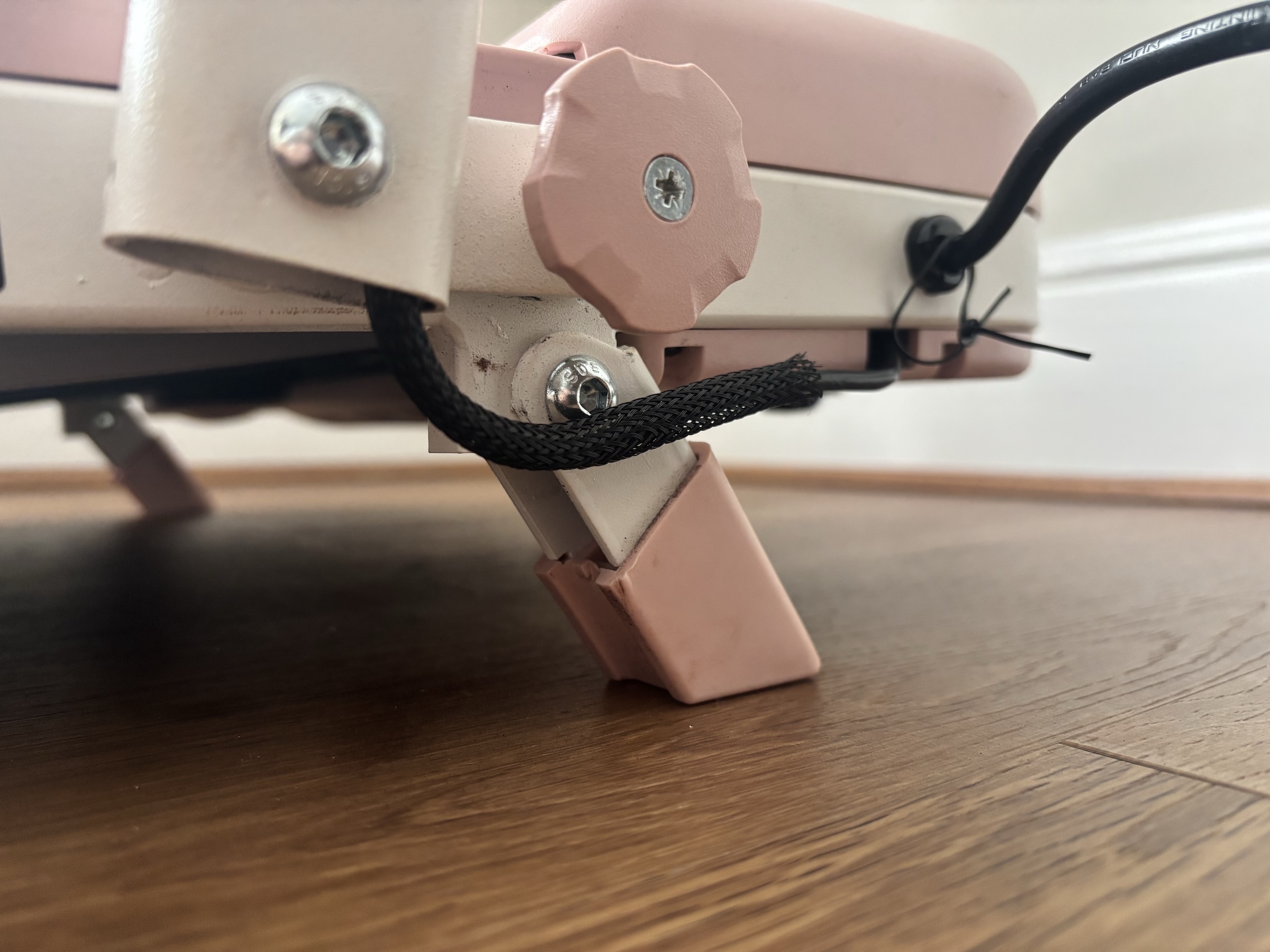 Close-up of the TM037 rear feet extended into the 5 percent incline position