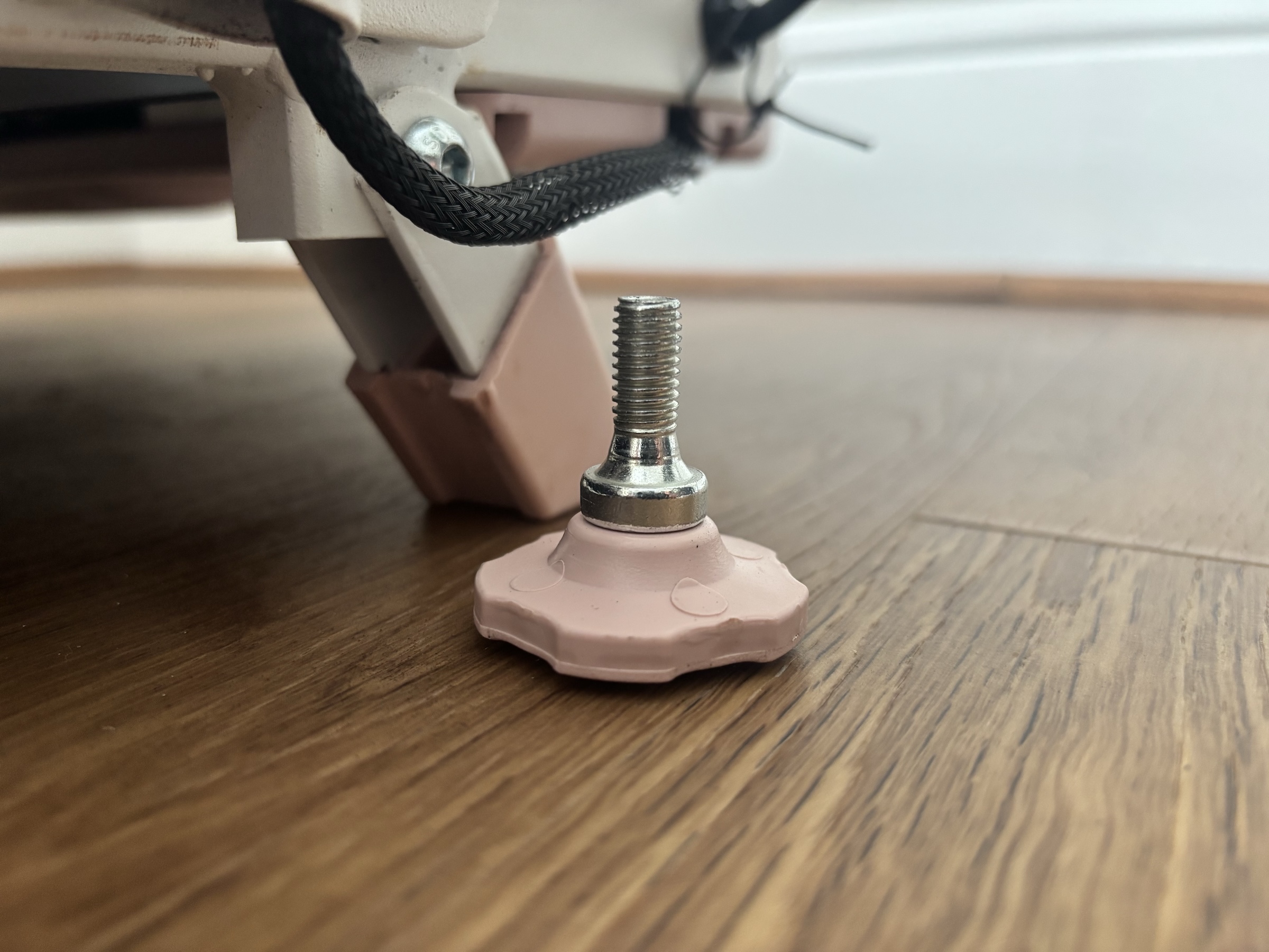 Close-up of the TM037 hand-turn handrail bolts with ergonomic grips