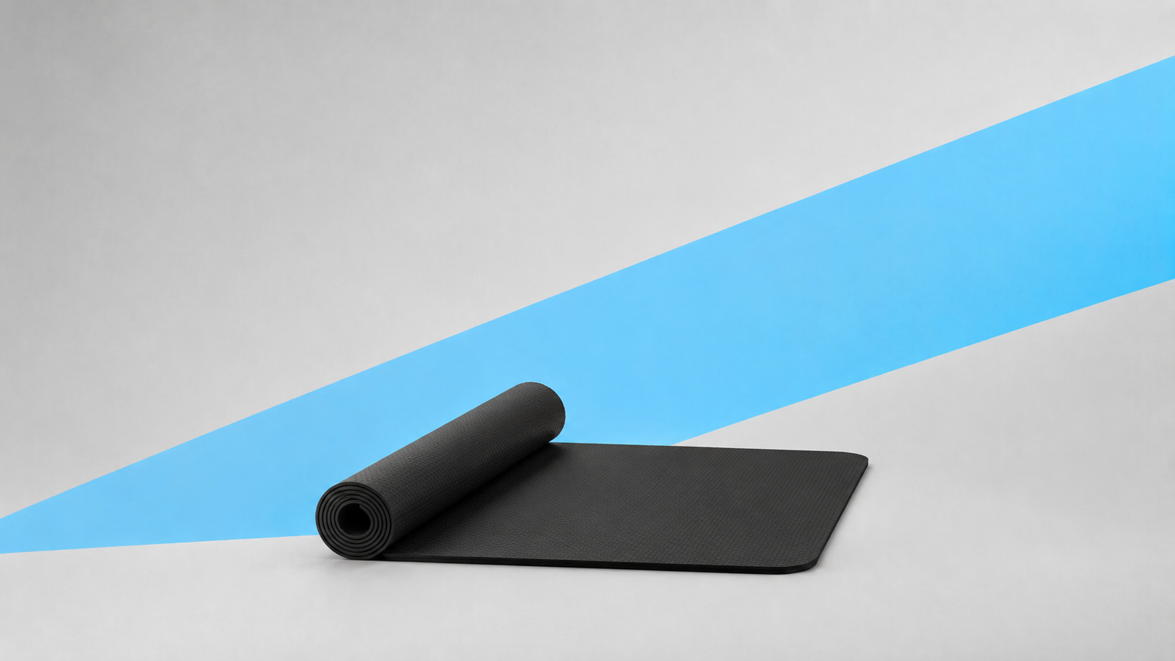 dense protective treadmill mat under a home treadmill on a hard floor