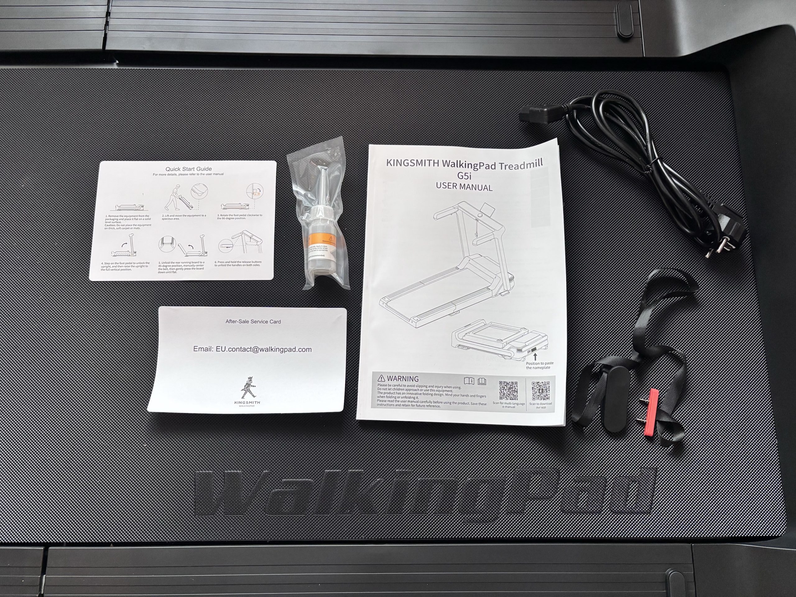 The full tool package: lubricant, manuals, power cords and emergency stop
