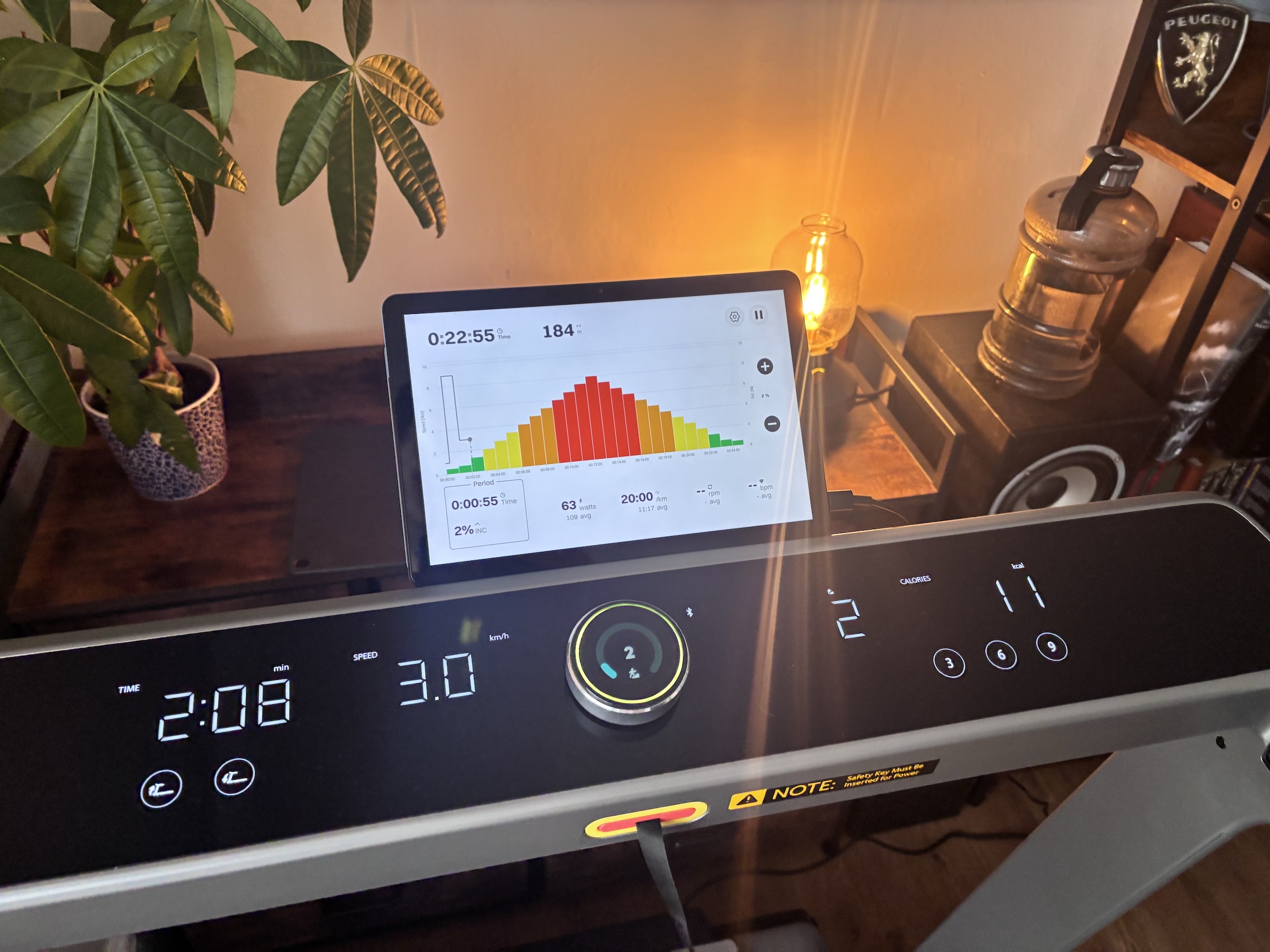 Wide shot of the console showing stats with a tablet running Kinomap