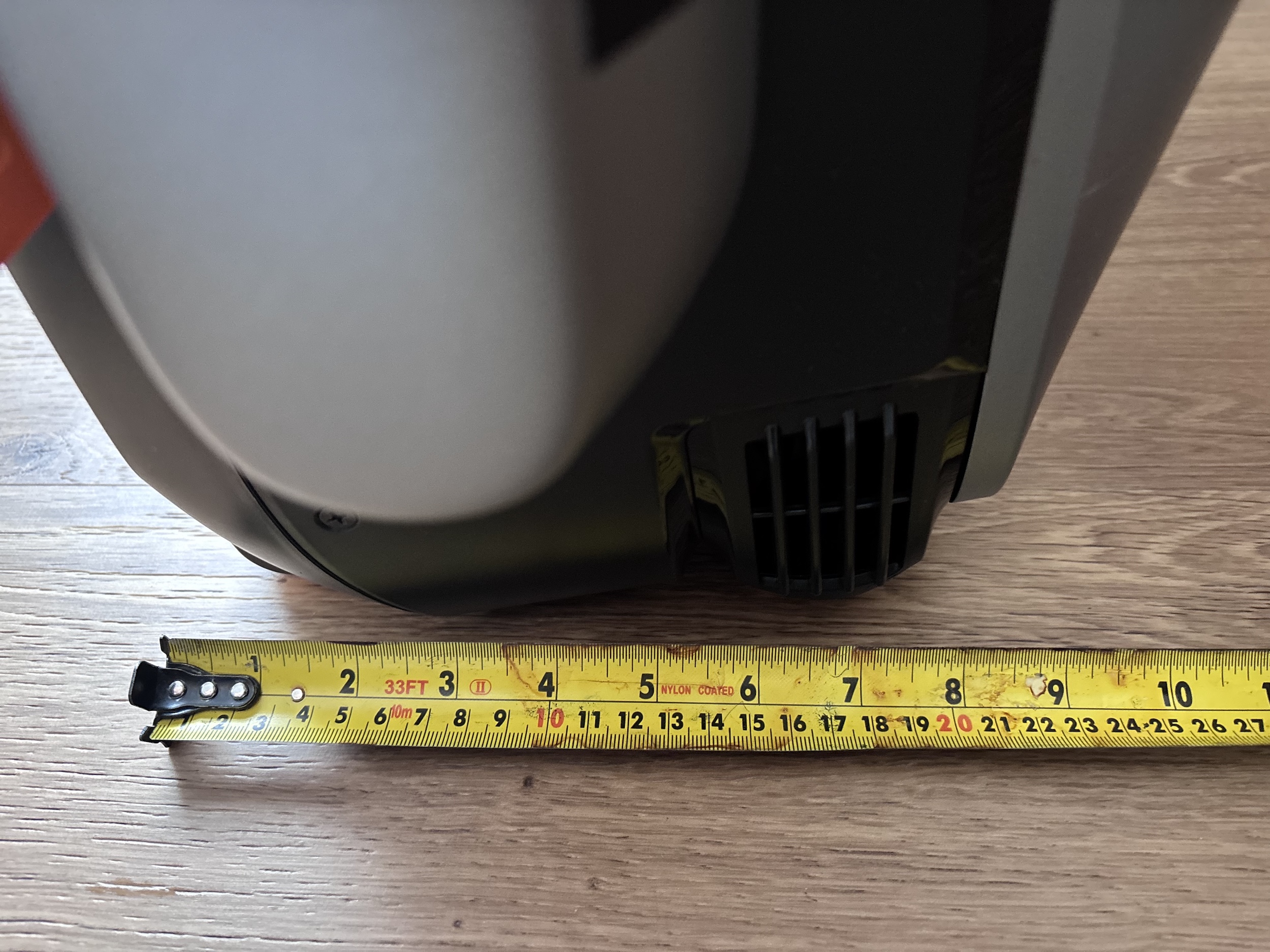 Tape measure showing the folded upright depth is around 23 cm