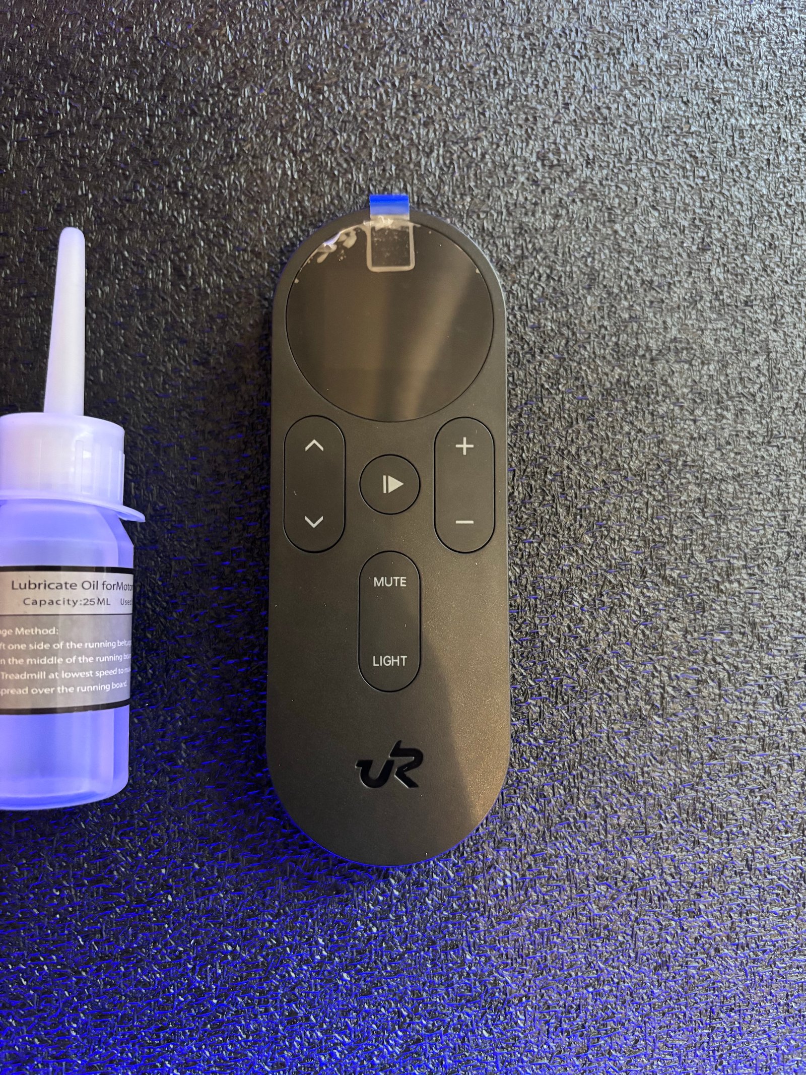 UREVO CyberPad remote control with LCD screen and workout control buttons