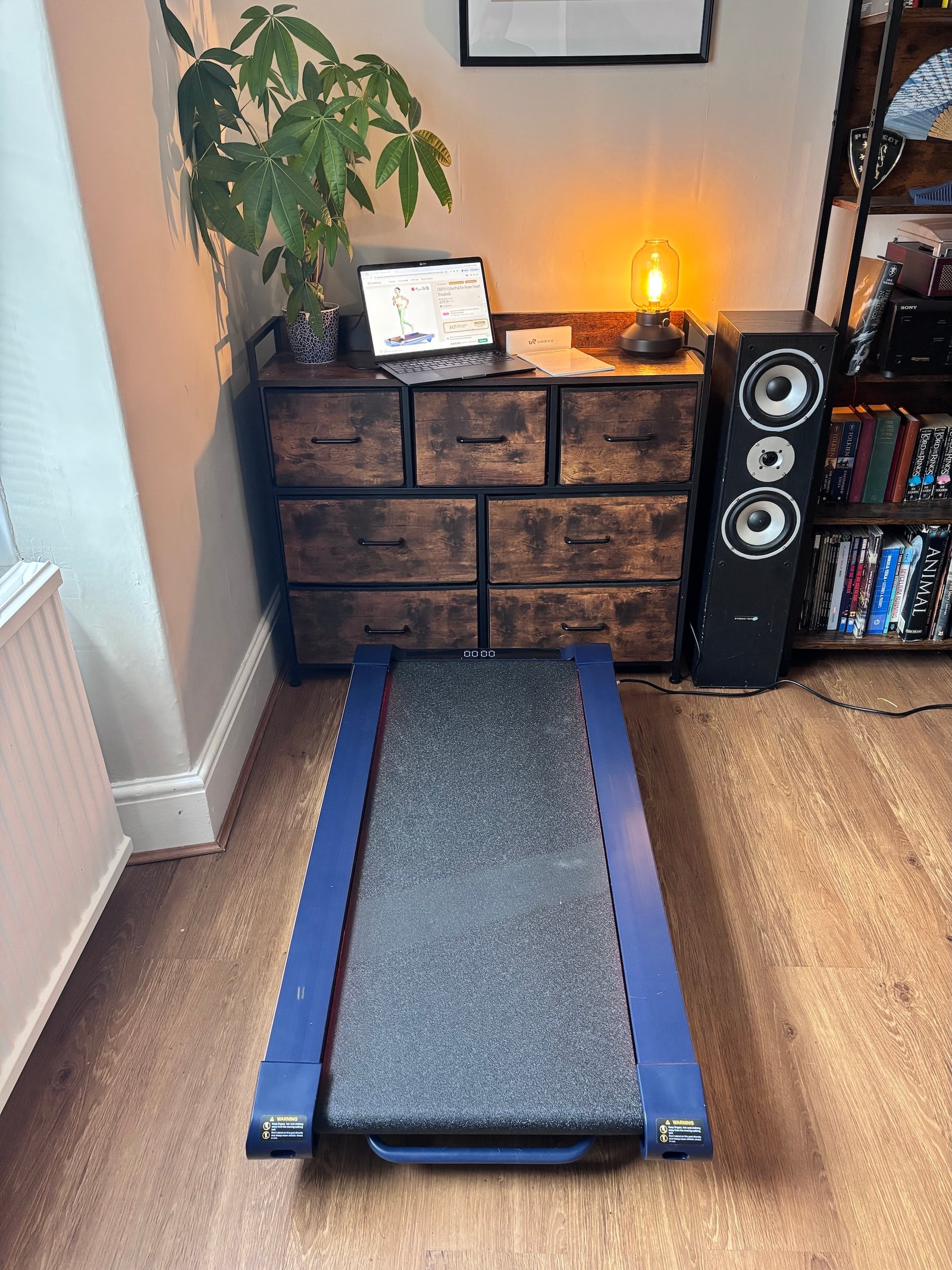 UREVO CyberPad positioned in our home testing space with a laptop on the cabinet behind it